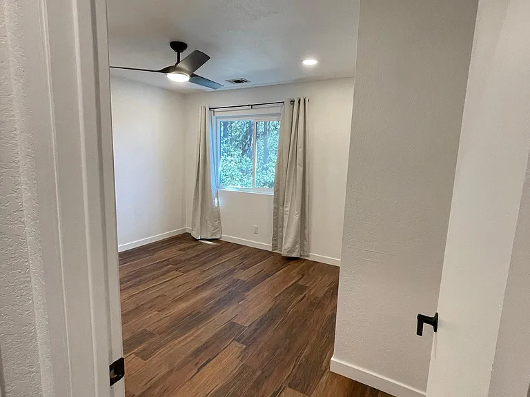 Bedroom 1. Light and airy. Every room has recessed lights with ceiling fans.