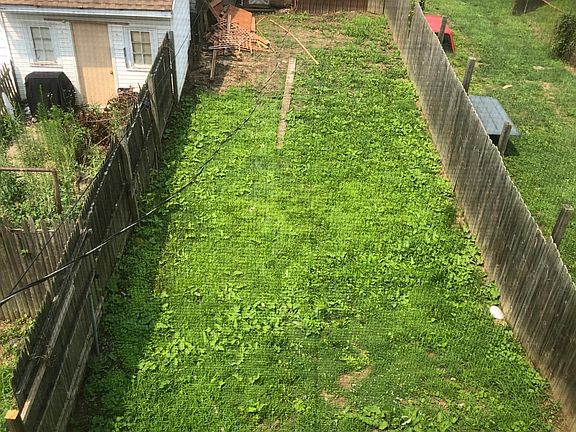 Back yard before new fence panels installed on left side , will need back and front side gates . Garage not included in rental