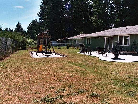 big toy tire swing, two swings, slide and fort