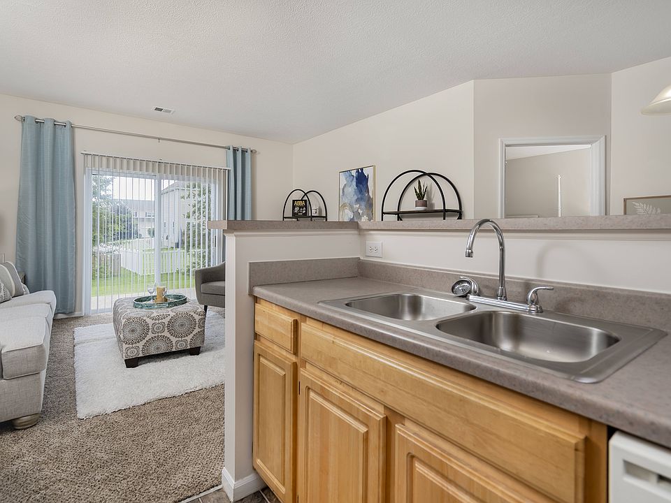 A sunlit kitchen with modern amenities, perfect for cooking and gathering with family.
