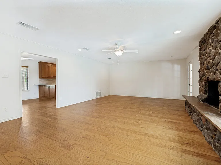 Living room with entry to kitchenette.