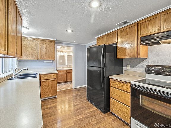 Range, Dishwasher, and Refrigerator all stay.