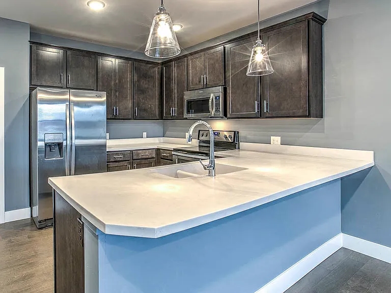 A spacious breakfast bar provides extra seating and a stylish space to gather.