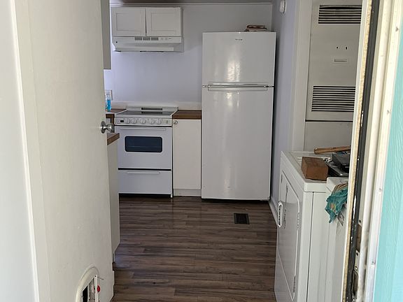 From back door (washer, dryer on right). Biggest bedroom on right after dryer
