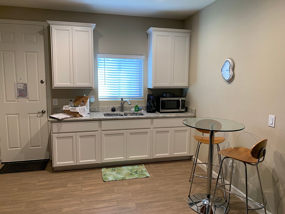 Kitchenette with plenty of cabinet space and full size sink.