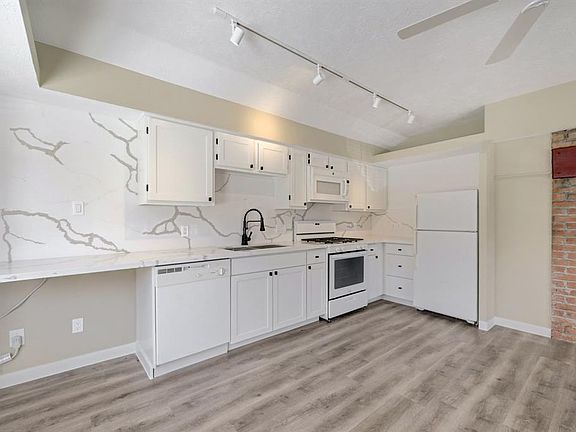 Well-appointed kitchen with updated features including a dish washer