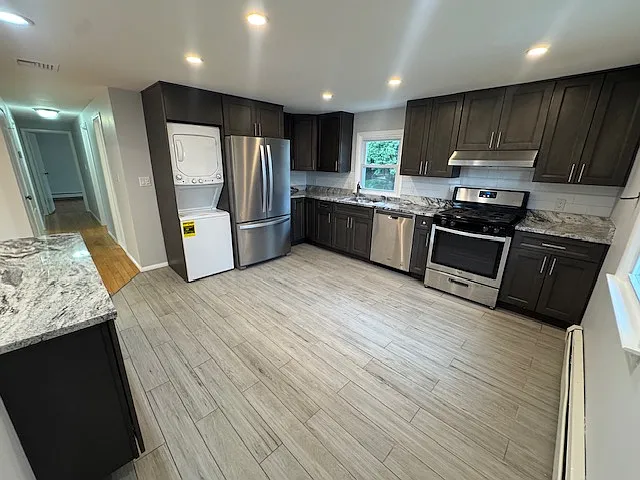 Eat-in-kitchen with refrigerator, dishwasher, stove/oven, brand new washer/dryer along with updated cabinets