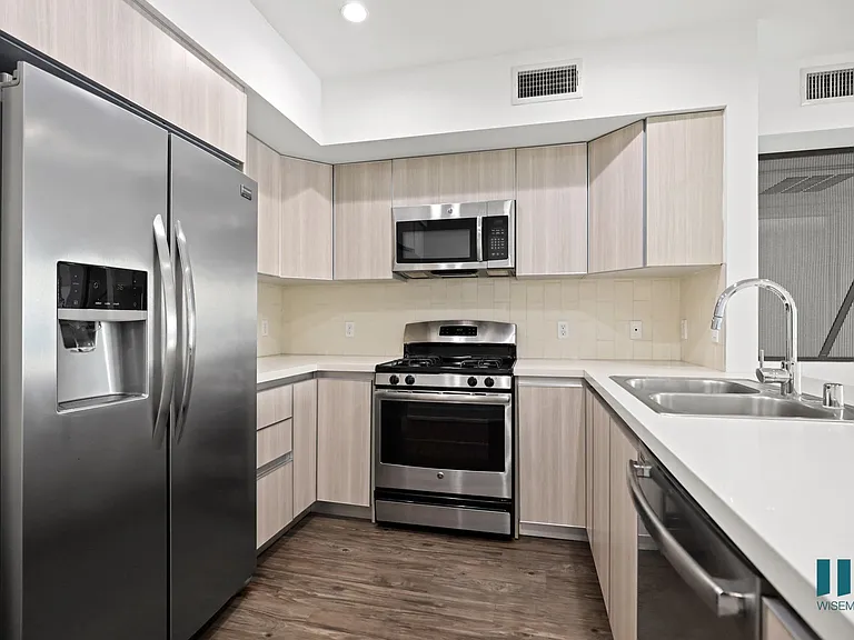 Kitchen with Stainless Refrigerator, Stove, Microwave Oven, and Dishwasher