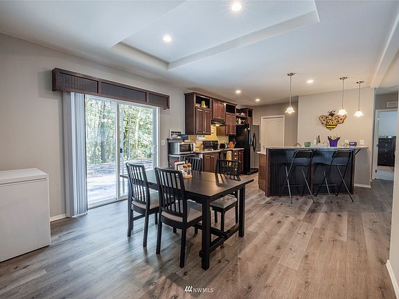 Dining area and kitchen. Plenty of room for gatherings. The sliders lead to your back patio.