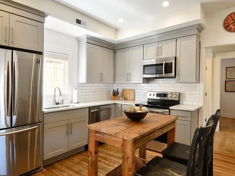 kitchen with island made from reclaimed wood from the house