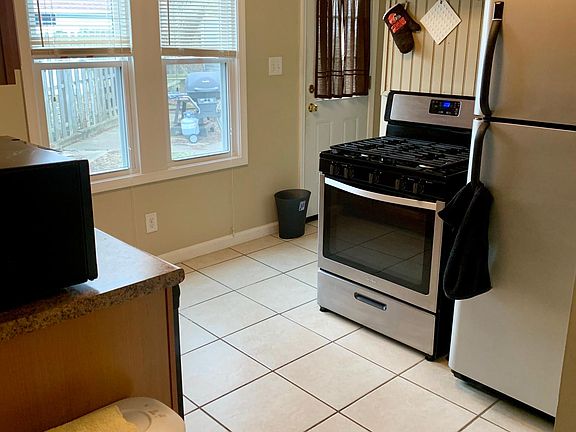 Kitchen - Stove and refrigerator in house