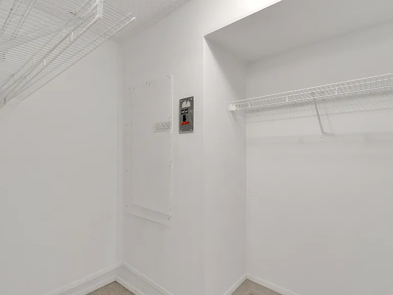 Entering the one side of HUGE Primary walk-in closet