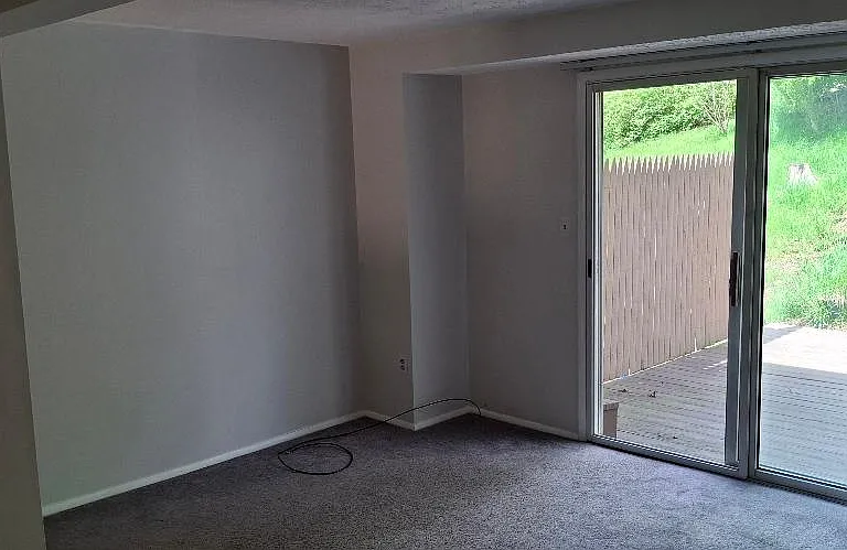 Large Living Room with Sliding Door access to private deck.