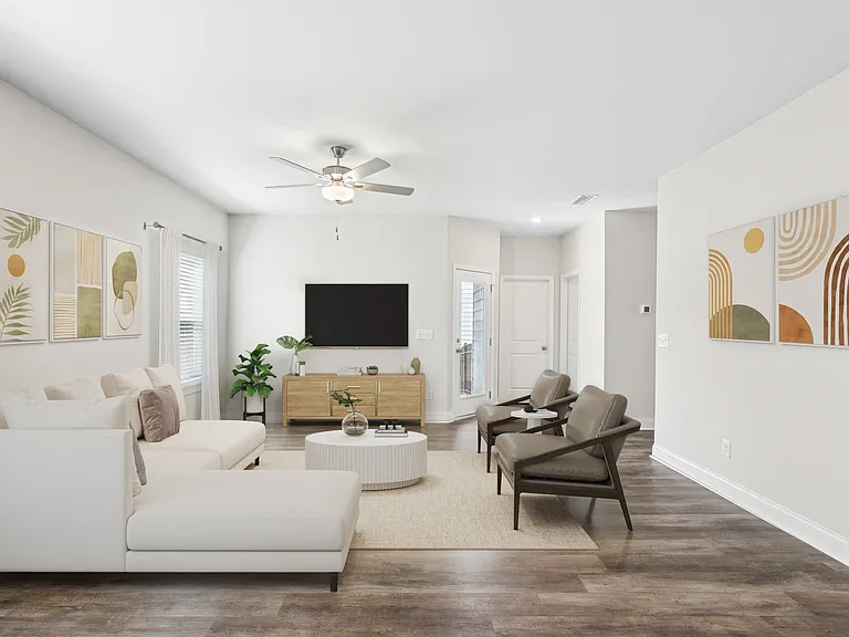 Living room with large window letting in a ton of natural light.