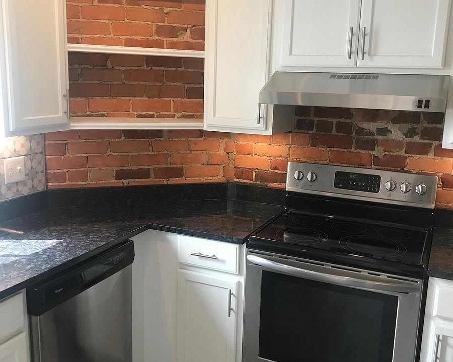 New stainless steel stove, stainless dishwasher and granite countertop.
 Floor is ceramic tile.