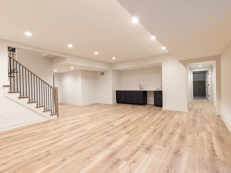 Family room. Basement. Wet bar. Hallway to bedrooms.