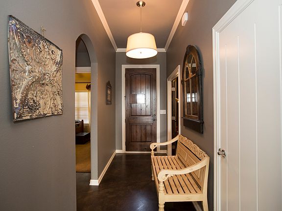 Grand entrance with stained wood door