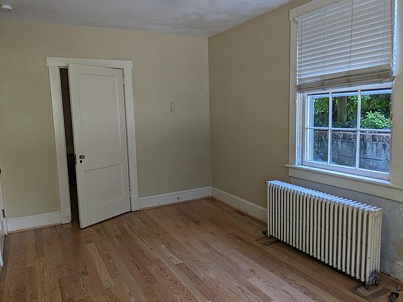 North face of front bedroom, showing door to the living room.