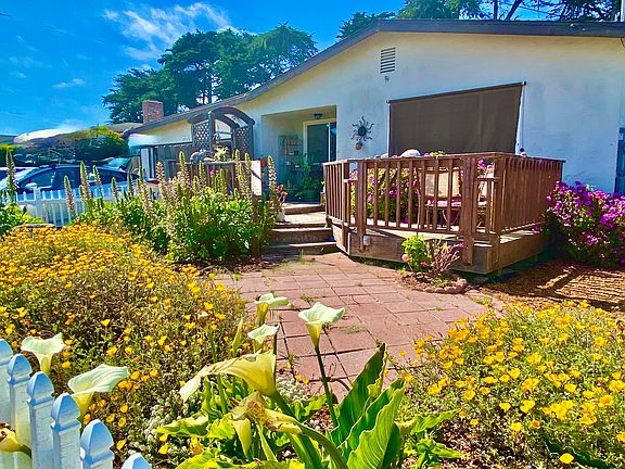 front of house with small deck