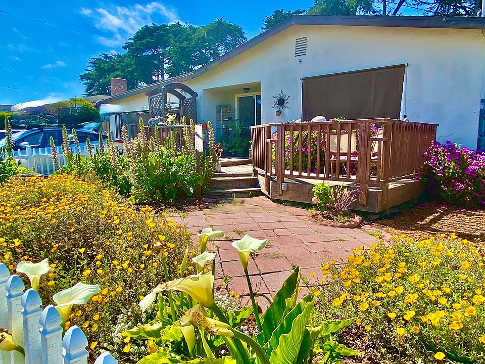 front of house with small deck
