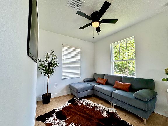 Living Room with Ceiling Fan! Tall Ceilings! Bright & Airy
