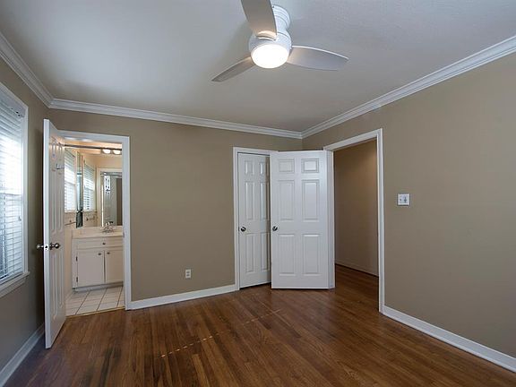 Primary bedroom with ensuite half bath