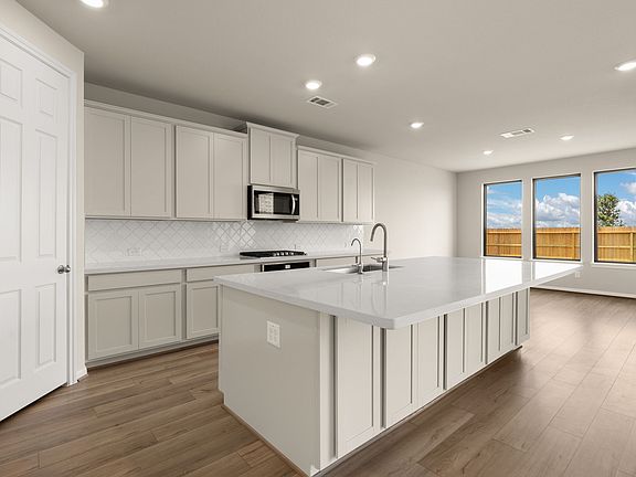 Kitchen. Note Sample product photo - actual exterior and interior selections may vary by homesite