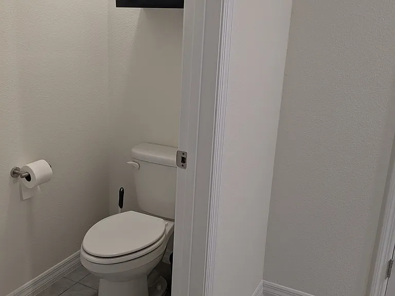 on-suite bathroom with two additional closets for storage