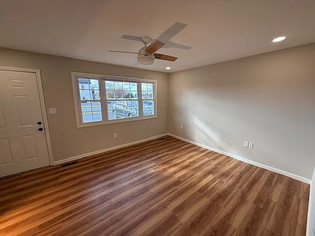 Living Room brand new luxury vinyl plank flooring (looks like hardwood). Freshly painted, new ceiling fan with lights, recessed lighting (dimmable).