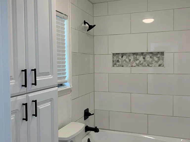 Second master bedroom in suite bathroom with access to the pool.