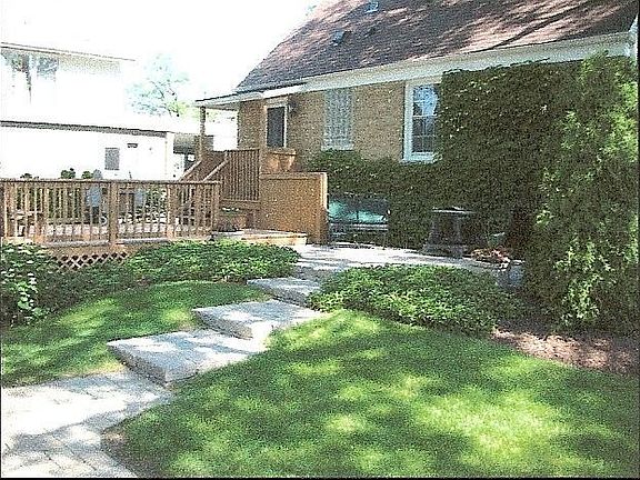 Brick patio and wood deck w/extra large yard!