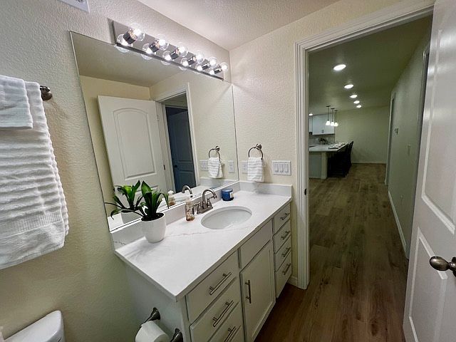 Bathroom sink and vanity with large mirror