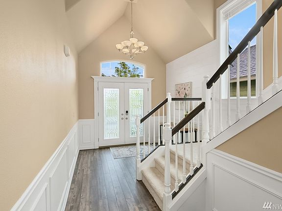Be sure to catch the vaulted ceilings and elegant chandelier. 