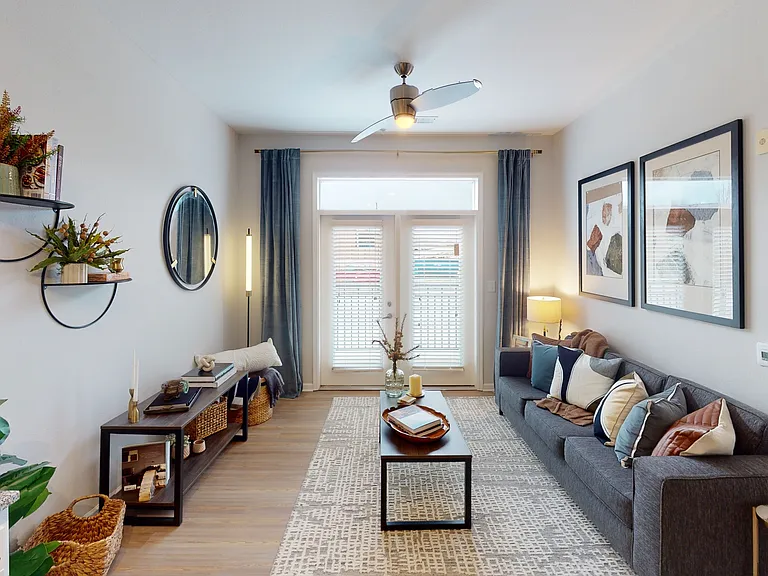 Open-Concept Living Room and Cozy Bedroom at Ralston Apartments in Downtown Indianapolis