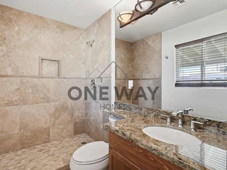 8702 E Sheridan St — Photo 19