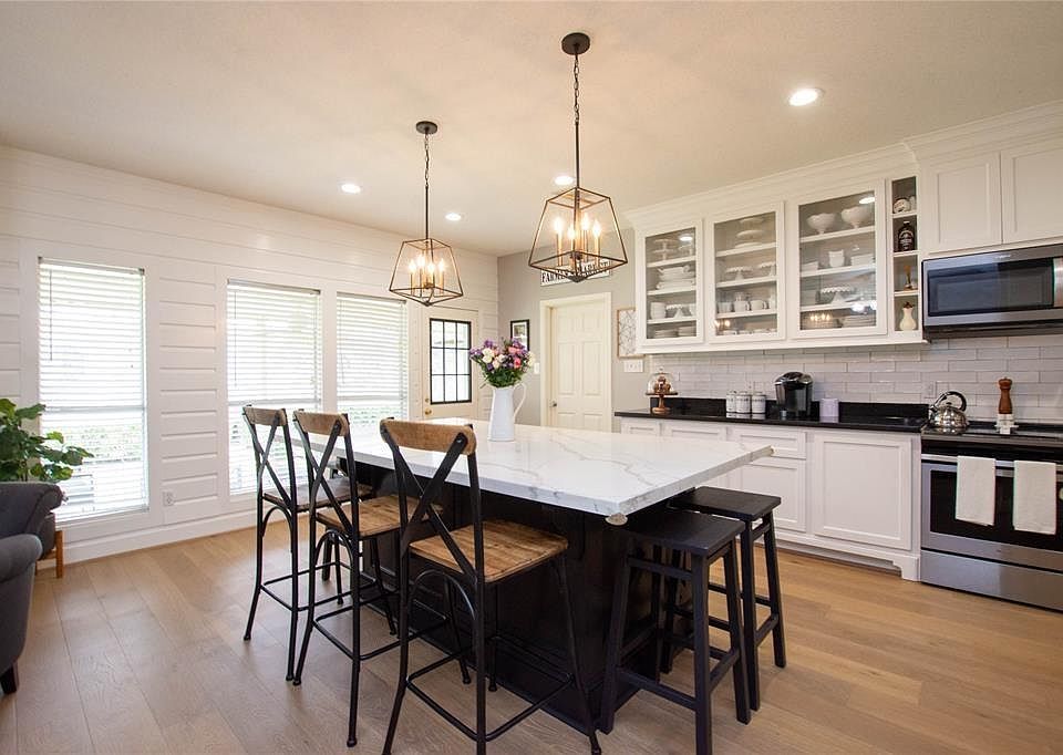 You'll love the custom island and stunning lighting fixtures!