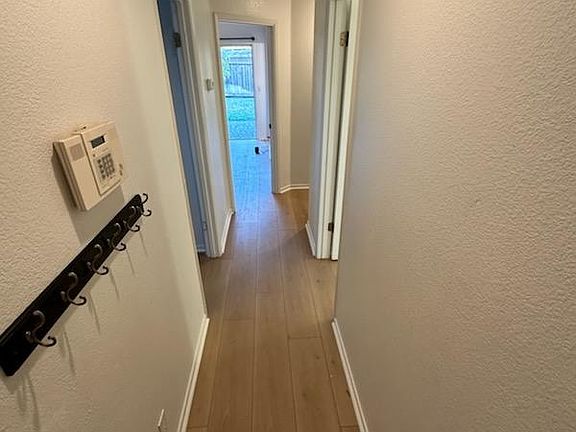 Hall way, bedroom on the left and right, master bedroom at the end of the hall.