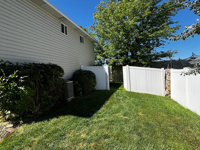 Side yard with gate leading to backyard