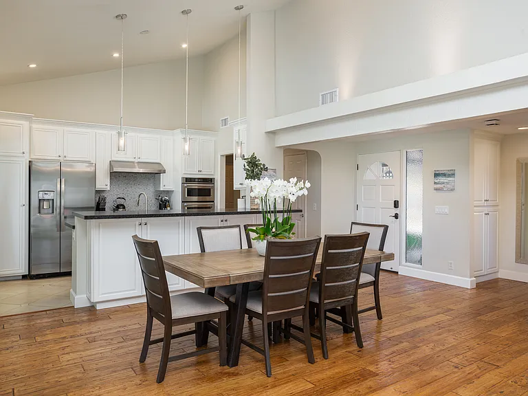 The dining area keeps the guests included with the guest in the kitchen and the living room.