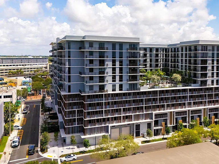 Building exterior with view of 5th floor pool and outdoor lounge