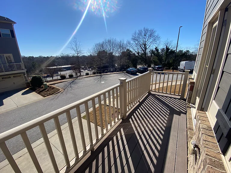 Deck off main floor looking into community parking and Wade Hampton Boulevard