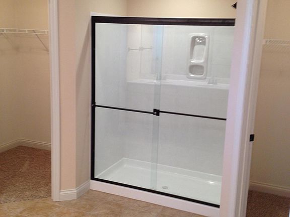 master bath marble shower with two walk in closets