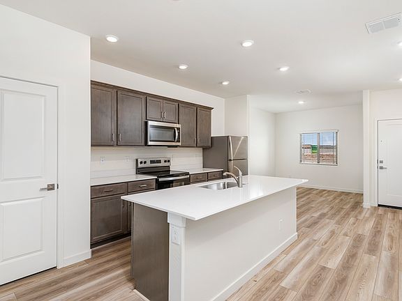 The kitchen seamlessly connects to the dining area.