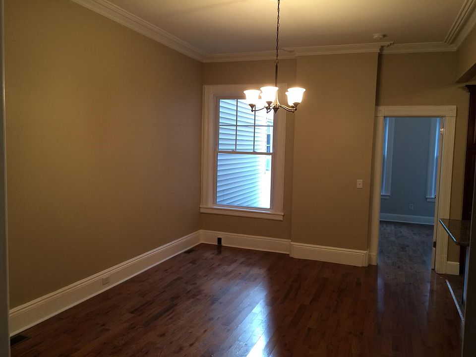 Living room with view into bedroom 2