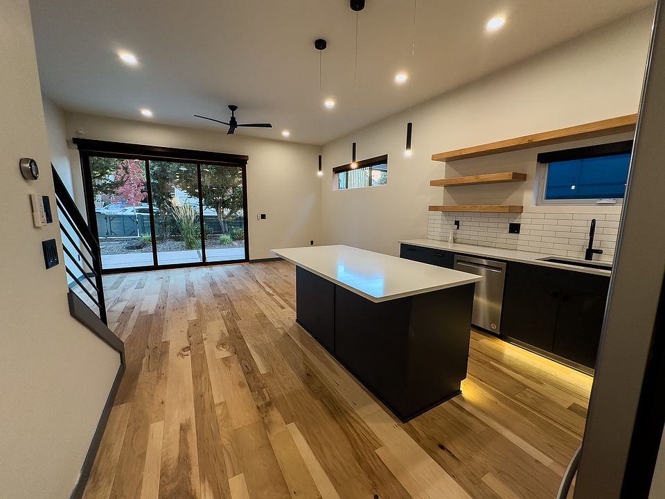 The kitchen/living room open to the front patio via a large three piece sliding door. Complete with automated shades for privacy when you want it.