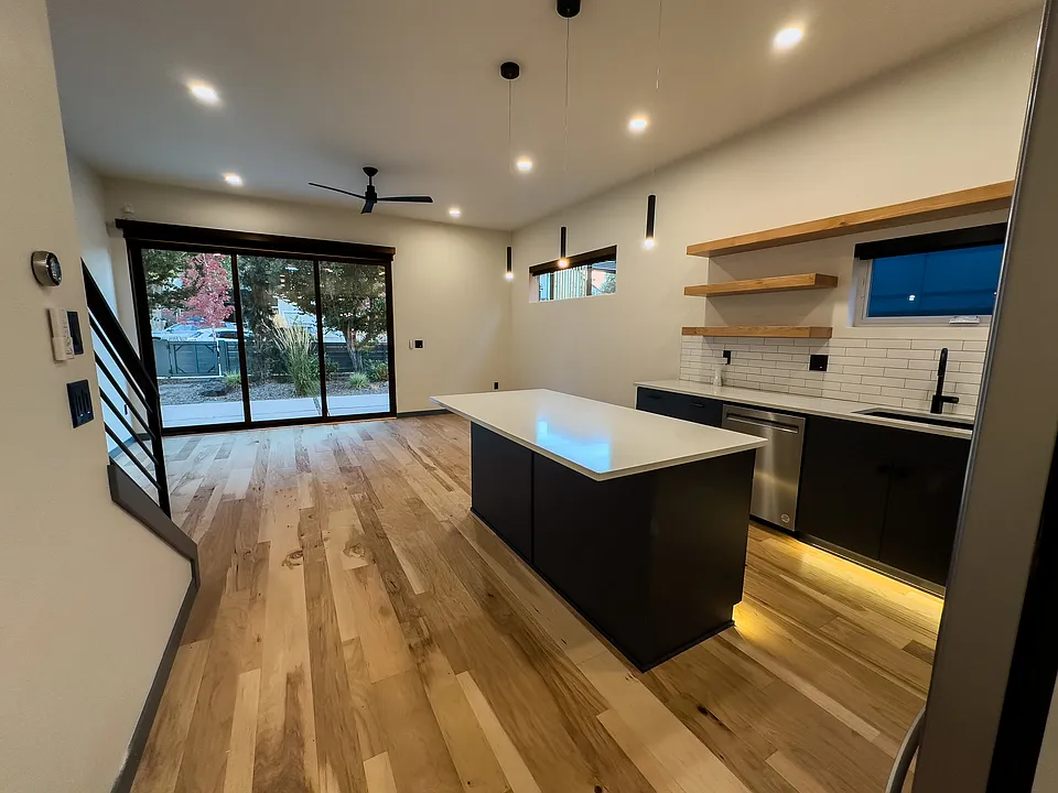 The kitchen/living room open to the front patio via a large three piece sliding door. Complete with automated shades for privacy when you want it.