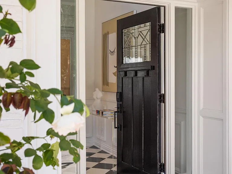 Step into style through the front door, where elegance meets a warm welcome in this Beverly Hills residence.