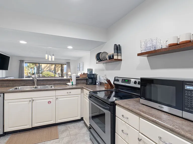 Full kitchen with Keurig, Oven, Refrigerator, Microwave and Dishwasher. Some kitchen supplies are available
