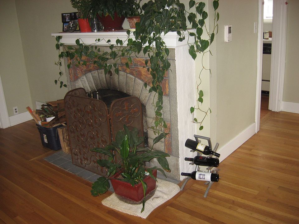 Refinished floors and fireplace in living room