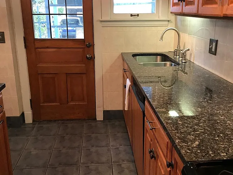 Back door leads to back porch, patio, and 2-car carport